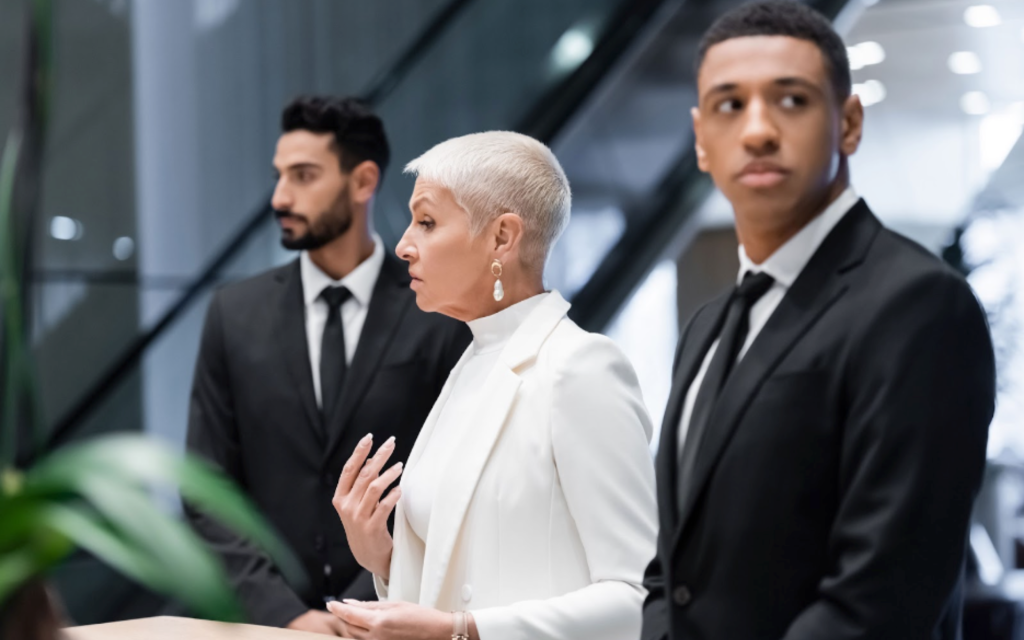 Woman with two executive security guards MPS Security