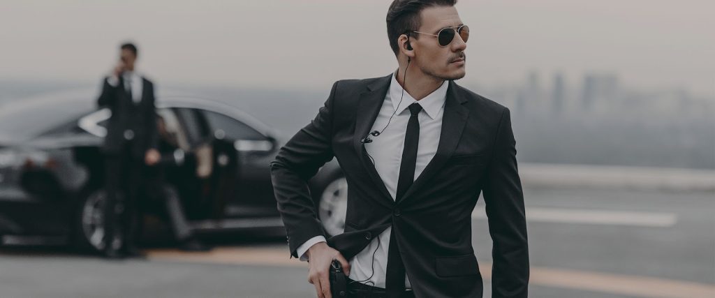 Armed bodyguard protecting executive client